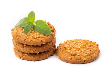 Oatmeal cookies with a green mint leaf on a white background. Diet food.