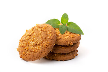 Oatmeal cookies with a green mint leaf on a white background. Diet food.
