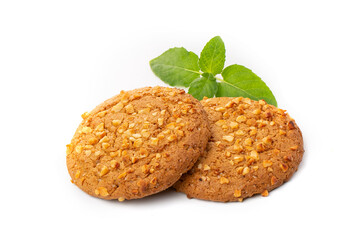 Oatmeal cookies with a green mint leaf on a white background. Diet food.