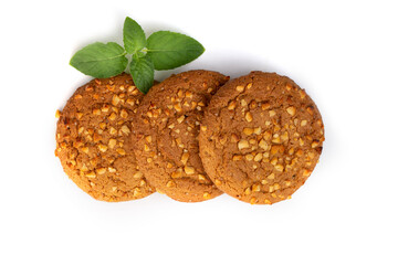 Oatmeal cookies with a green mint leaf on a white background. Diet food.