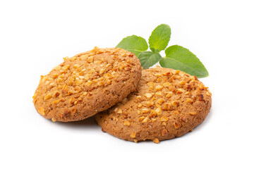 Oatmeal cookies with a green mint leaf on a white background. Diet food.