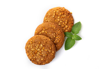 Oatmeal cookies with a green mint leaf on a white background. Diet food.