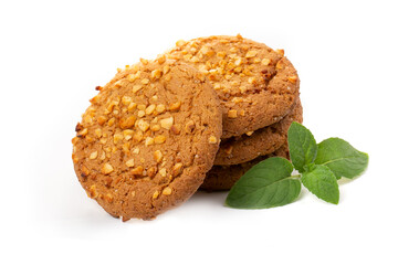 Oatmeal cookies with a green mint leaf on a white background. Diet food.