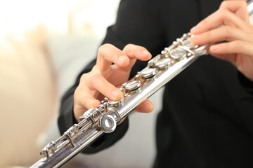 Flute classical instrument profestional player playing song. Instructor practicing bronze woodwind for orchestra as solo.