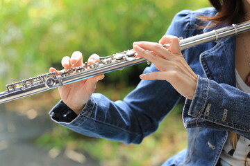 Flute classical instrument player playing song. Instructor practicing bronze woodwind for orchestra...