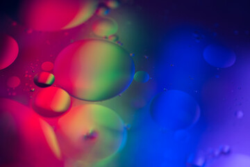 Close up Macro colorful oil and water circles iluminated abstract