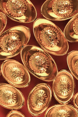 Golden chinese traditional money on red color background. Representing rich, wellness, properity, lucky, happiness for Chinese New Year celebration