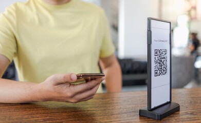 Qr code payment. E wallet. Man scanning tag accepted generate digital pay without money.scanning QR code online shopping cashless payment and verification.technology concept