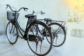 Naklejka na ściany i meble 2 old bikes parked by the river