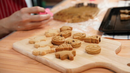 Ginger bread cookies homemade cooking for Christmas traditional dessert. Kids and family love to prepare to make dough and bake them. Then paint them with sugar paste to decor in many colors.