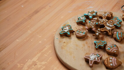 Ginger bread cookies homemade cooking for Christmas traditional dessert. Kids and family love to prepare to make dough and bake them. Then paint them with sugar paste to decor in many colors.