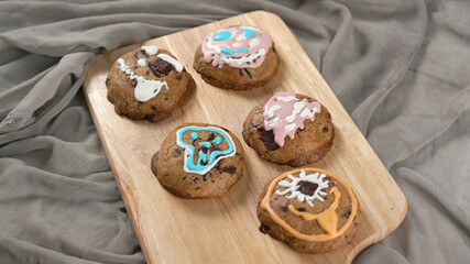 Ginger bread cookies homemade cooking for Halloween traditional dessert. Kids and family love to prepare to make dough and bake them. Then paint them with sugar paste to decor in many colors.