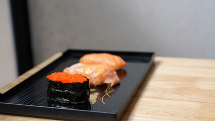 Sushi on plate. Variety Japanese rice in roll with many kinds of topping. Healthy menu.