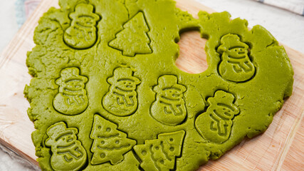Green ginger bread cookies homemade cooking for Christmas traditional dessert. Kids and family love to prepare green tea cookies. Celebreation cookes for Chirstmas.
