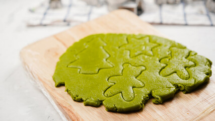 Green ginger bread cookies homemade cooking for Christmas traditional dessert. Kids and family love to prepare to make dough and bake them. Green tea cookies