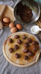 Oatmeal and banana chocolate cookies while preparation from dough to baking. Dessert recipe of pastry. Sweet homemade bake