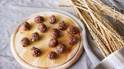 Oatmeal and banana chocolate cookies while preparation from dough to baking. Dessert recipe of pastry. Sweet homemade bake