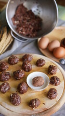 Oatmeal and banana chocolate cookies while preparation from dough to baking. Dessert recipe of pastry. Sweet homemade bake