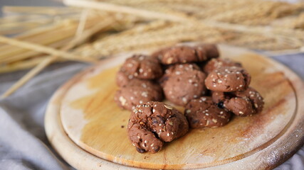 Oatmeal and banana chocolate cookies while preparation from dough to baking. Dessert recipe of pastry. Sweet homemade bake