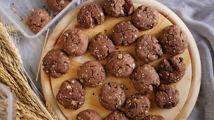 Oatmeal and banana chocolate cookies while preparation from dough to baking. Dessert recipe of pastry. Sweet homemade bake