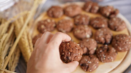 Oatmeal and banana chocolate cookies while preparation from dough to baking. Dessert recipe of pastry. Sweet homemade bake
