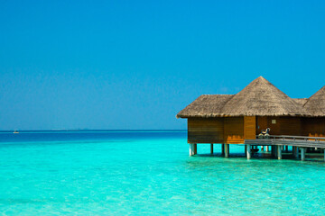 Maldives paradise scenic landscape. Seascape with water bungalows, turquoise sea and lagoon waters, tropical nature. Exotic tropical island beach background. Romantic holiday & honeymoon destination.