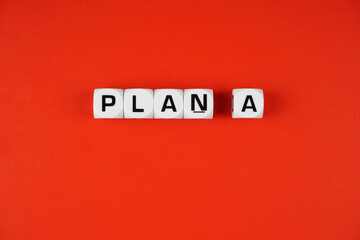 PLAN A. Cube blocks with alphabet building the word plan b. Selective focus.