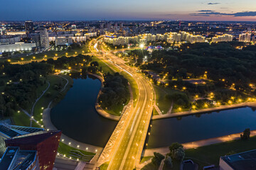 Minsk city at sunset. aerial panoramic view at night with city lights. drone photo.