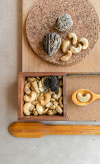 Flat lay with nuts and wooden spoons