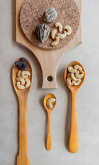 Flat lay with nuts and wooden spoons