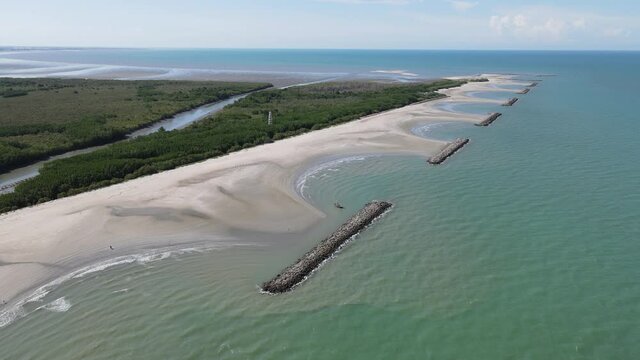 Breakwaters of rocks in a stormy sea. Aerial view.