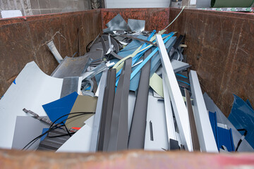 Fototapeta na wymiar Pile of waste metal in recycle bin