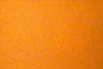 金属テクスチャー オレンジ色に塗装された鉄板に細かい錆が浮き出る