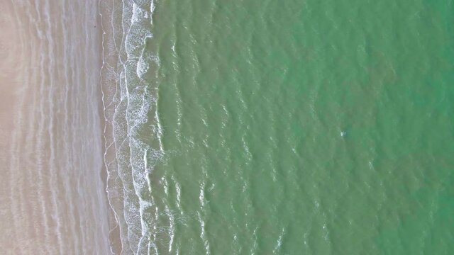 Aerial view over sea. Beautiful sea waves. Top view .