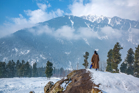 A young Kashmiri man standing in Beautiful Valley "Kanimarg" near Pahalgam