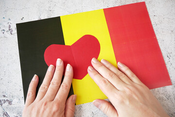 I love Belgium. Red heart symbol on Belgium flag background. national holiday of Belgium...