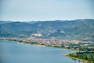 Fototapeta na wymiar Nicea Iznik lake (iznik golu) with green plants and forest Top and aerial view of famous and huge lake.