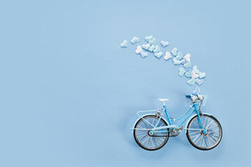 Metal blue bicycle with hearts, present for dad. Father's day concept.