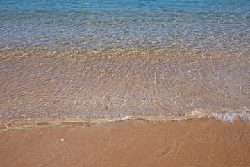 Summer vacation, holiday background of a tropical sandy beach and blue sea. Hawaii beach.
