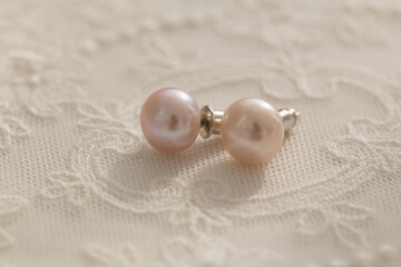 Pink pearl pieced earrings pair fine jewelry isolated.