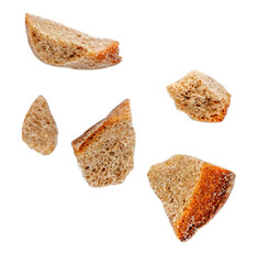 Flying bread pieces isolated on white background.  Bread crumbs macro.