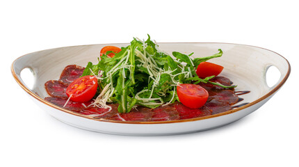 Beef carpaccio with arugula and tomatoes isolated on white