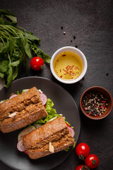 Sandwiches with vegetables for lunch on a black background