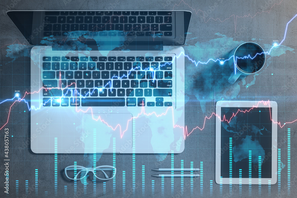 Poster global market and investment concept with organized work table space: laptop, digital tablet and cof