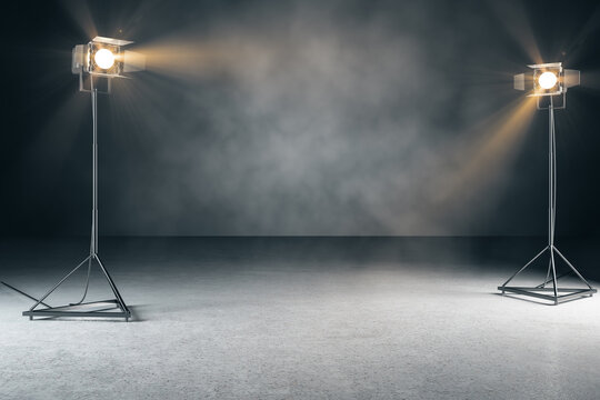 Creative concrete photo studio background with lamps and mockup place. 3D Rendering.