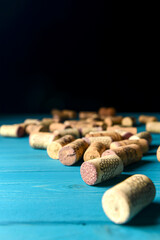 Collection set of wine corks over pastel blue rustic wooden background. Art concept, creative idea. Spring table