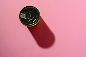 Canned food tin on pink studio background