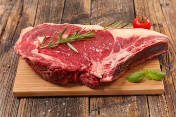 raw beef- prime rib eye on board