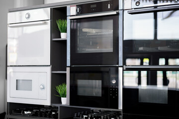 Electrical ovens, home appliances in the store..