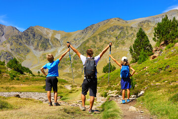 happy family hiking in the mountain